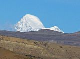 Tibet Kailash 06 Tirthapuri 15 Kamet From the Tirtapuri kora, I looked toward the west and spotted Kamet peaking above the horizon. On the left is the rocky south face, in sharp contrast to the smooth snowy north face to the right. Kamet (7756m) is the second highest mountain in the Garhwal region of India after Nanda Devi and the 24th highest in the world.